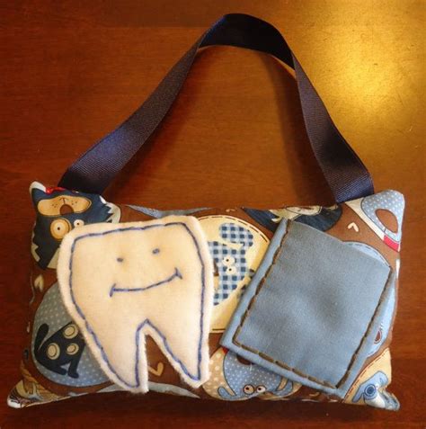 Beneath this pillow i will keep my missing tooth while i'm asleep so when the fairy comes at night she'll spot it quickly while in flight. Boys Puppy theme Tooth Fairy Pillow by SweetPeainLa on Etsy, $10.00 | Tooth fairy pillow, Tooth ...