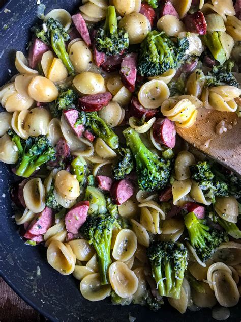 Pasta is mixed with smoked sausage and a tomato sauce, topped with breadcrumbs and cheese, then baked to perfection. One Pot Smoked Sausage Broccoli Pasta - The Skinnyish Dish