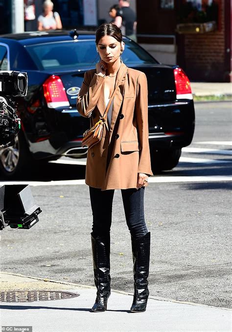 She rose to prominence after appearing in the music video for robin thicke's blurred lines. Emily Ratajkowski cuts a chic figure in brown coat with ...