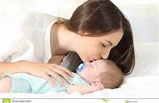 kissing baby her mother affectionate sleeping side preview