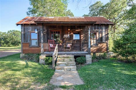 This texas tiny house cabin rental is located in waco, texas, and can accommodate four guests for a unique and peaceful getaway to the countryside. The rustic Cowboy Cabin was built from salvaged materials ...