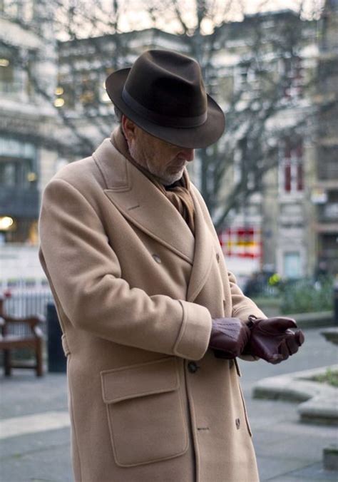 This trench coat has two front pockets and a fake belt detail in the back. Four Favorite Overcoats A classic men's overcoat is ...