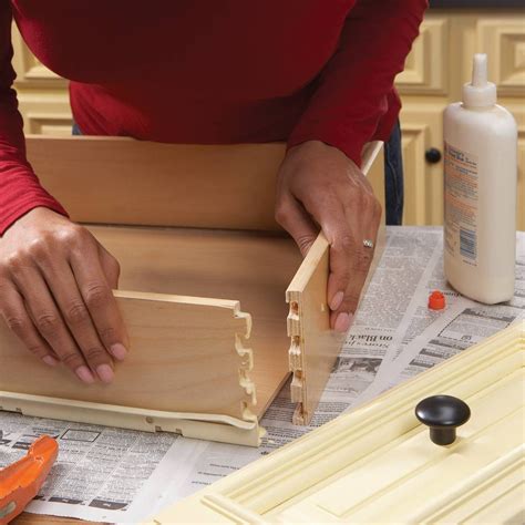 Open the drawer as normal. Home Repair: How to Fix Kitchen Cabinets