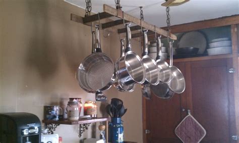 Free shipping site to store. We hung an old ladder from the ceiling to hang our pots ...