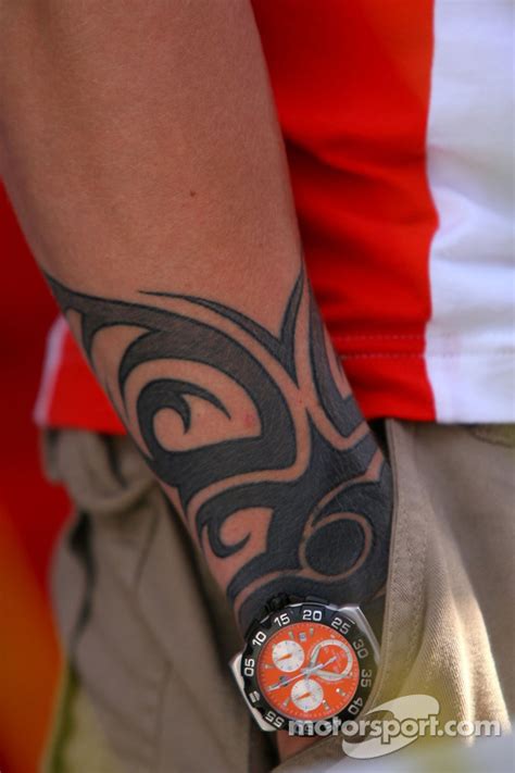 The cap carries a direct link to lewis in the form of the chinese embroidery symbolising 'warrior' and 'love', taken from one of his actual tattoos. Kimi Raikkonen, Scuderia Ferrari, has a tattoo on his arm ...