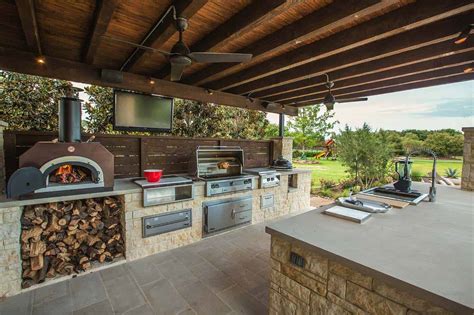 Even the gas grill, featured in every outdoor kitchen, can go above and beyond with features like fuel gages, flamethrower ignitions and a smoker built right in. 38 Absolutely Fantastic Outdoor Kitchen Ideas For Dining ...