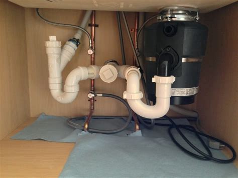 Garbage disposal and dishwasher are often connected to a kitchen sink for drainage water once the washing cycle is complete. Plumbing A Double Sink With Disposal And Dishwasher ...