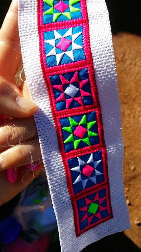 A traditional pink, white and green flowers | Hmong embroidery, Beaded ...