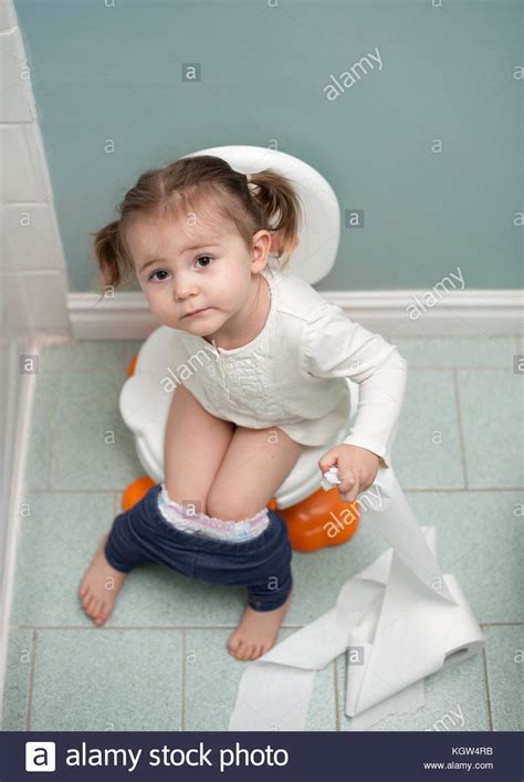 Congratulations, you've found what you are looking young cutie banging in a bathroom ? Toddler girl potty training holding toilet paper in ...