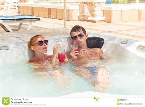 Performance, reliability, and ease of use. Young Couple Relaxing In Jacuzzi Pool Stock Photo - Image ...