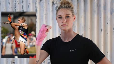 Afl women's star tayla harris says she fears for her safety after photo of her kicking for goal was taken down from sites due to 'repulsive' comments. Tayla Harris AFLW photo: Boxing story on journey