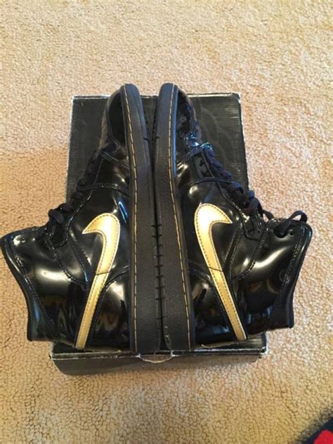 The air jordan 1 mid metallic gold features lux golden patent leather on the toe region, eye stays, rear, and heels. Air Jordan 1 Black Gold Metallic 2003 Patent Leather | Kixify Marketplace