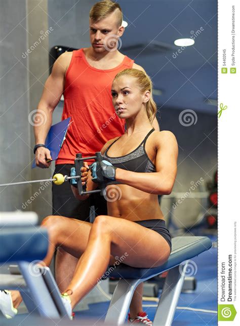 Trying to pose at home flexing bicep of the arm you make small fibers contract each other, which are called a muscle cell and contain a huge number of other micro links like sarcomeres. Man And Woman Flexing Muscles On Gym Machine Stock Image ...