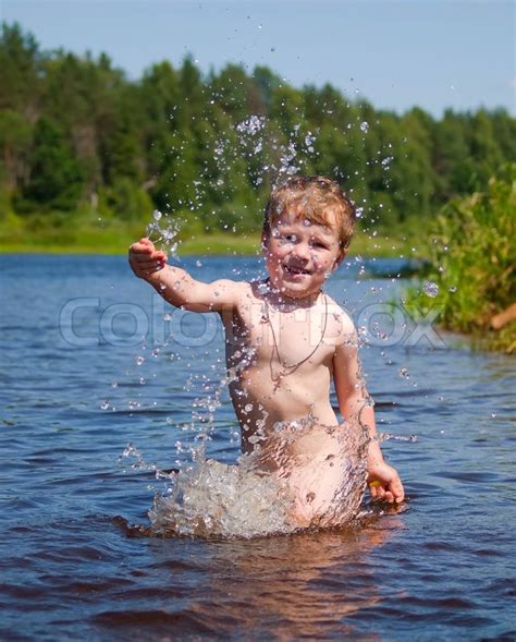 Baikal films « 1 2 3 » whitetail river waterfall boys. The swimming boy in the river | Stock Photo | Colourbox