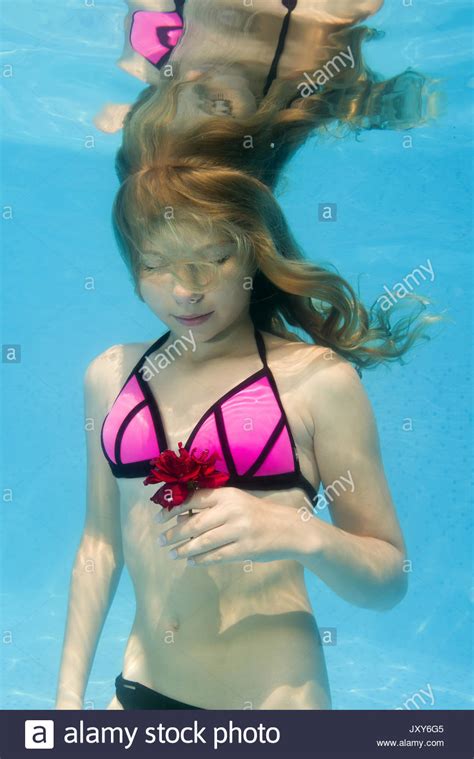 Flexible posing in the pool. Teen Girl Underwater In Swimming High Resolution Stock ...