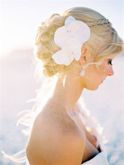 Depending on how humid the weather is, be sure to use a product that will help prevent hair frizzing or falling flat. Beach Wedding Hairstyles
