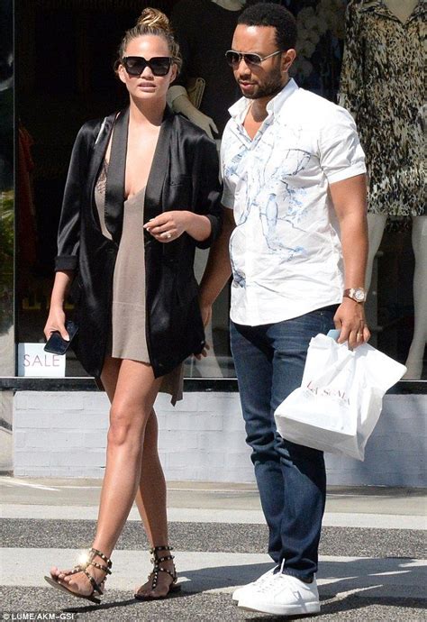 Chrissy teigen nearly spills out of tiny lace bralet in nyc. Chrissy Teigen and husband John Legend look in bliss on ...