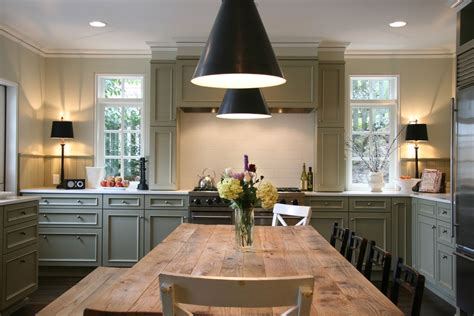 Table top and blur interior background. Fabulous kitchen with farm table in the center. Neil Kelly ...