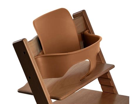 Due par la couleur, pas assez blanche a mon gout elle correspond plutt a couleur bois. Stokke - Chaise haute Tripp Trapp Noyer