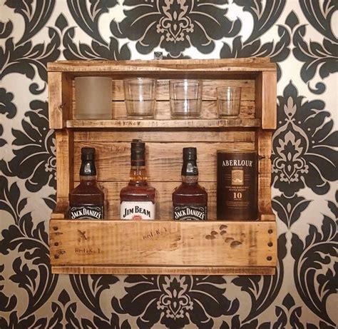 Well you're in luck, because here they come. Rustic Whiskey Rack (With images) | Whiskey rack ...