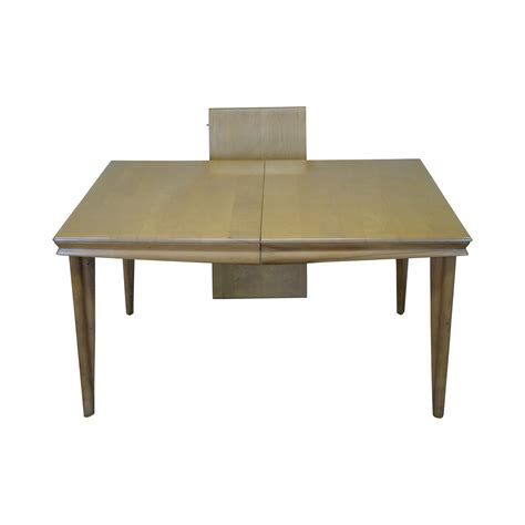 The table has turned splayed legs. Heywood Wakefield Champagne Maple Dining Table | Chairish