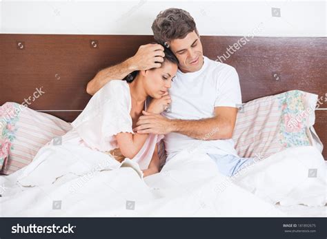 The extra 1 in that woman belle nko. Man Consoles His Wife Lying Bed Stock Photo 181892675 ...