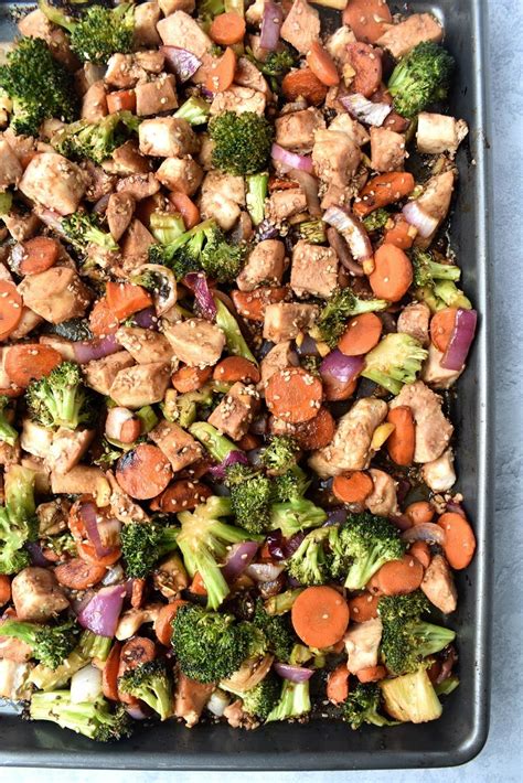 Chicken with a honey garlic sesame glaze baked with broccoli for a complete meal! Sheet Pan Sesame Chicken | The Nutritionist Reviews