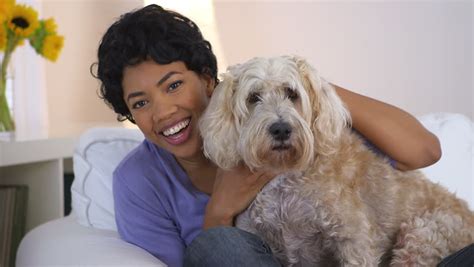 Our doctors and hospital staff strive to continue their education to bring you the highest quality care available. Pretty Caucasian Woman Petting The Dog At The Veterinarian ...