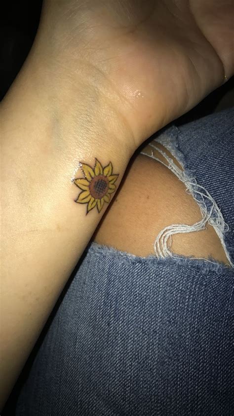 Flower wrist tattoos remain a popular choice for many reasons. Pin by Naomi Marie on Tattoos/Ideas | Sunflower tattoo ...