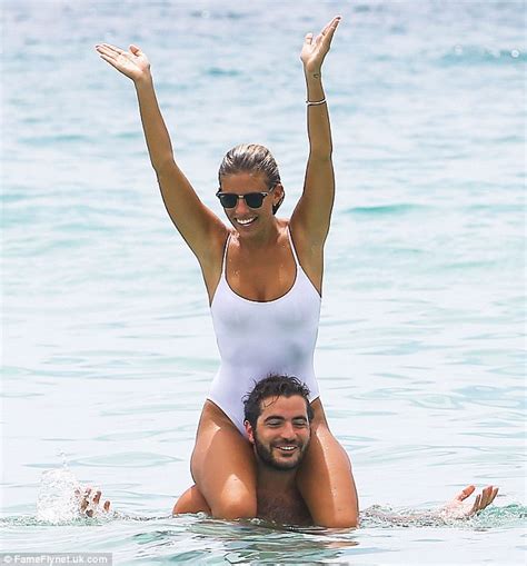 Want to watch this video again later? Natasha Oakley wears a white one piece as she frolics in ...