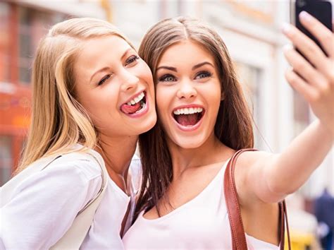 Three friends that have been true companions for most of their lives; Picture Smile Selfie Two Girls Tongue Hands