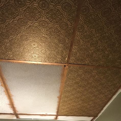 I used genesis ceiling panels to update my drop ceiling. Do it yourself Faux Tin Ceiling tiles | Faux tin ceiling ...