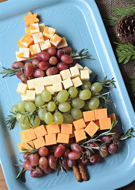 Cut bread slices into christmas tree shapes using large cookie cutters. Cheesy Christmas tree | Eat North | Christmas party food, Xmas food, Christmas food