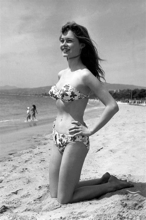 The camel at the close of day kneels down upon the sandy plain. Brigitte Bardot in Cannes in 1953 bikini (With images ...