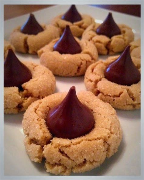 Chocolate packed hershey kiss cookies are rolled in sugar & baked with a hershey's kiss in the middle. Kiss Blossoms | Hershey kiss cookie recipe, Kiss cookie ...