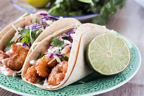 So dang delicious, you won't know what hit you! Crispy Sweet Chili Shrimp Tacos with Cilantro Slaw ...