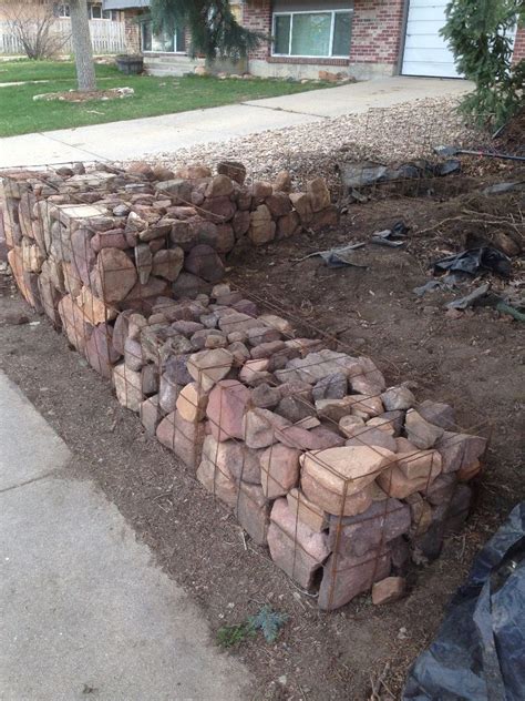 The gabion wall, which is often referred to as a gabion fence, is one solution that is both affordable, and relatively fast to construct. Picture of Cheap DIY Gabion Baskets | Hage