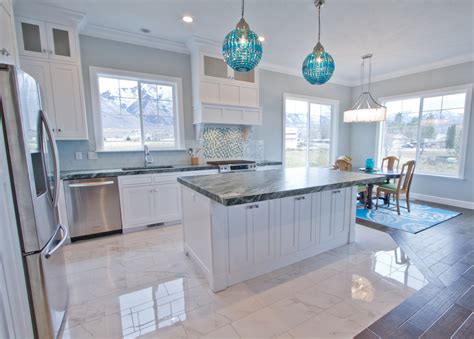 Tiny home kitchen with cobalt blue cabinets, cambria ella countertops, and white shiplap ceiling and walls. How To Design A Coastal Kitchen