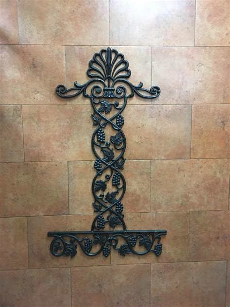 It is consists of soap basket, towel ring, and toilet paper holder. This Wrought Iron in a Restaurant Bathroom : mildlypenis