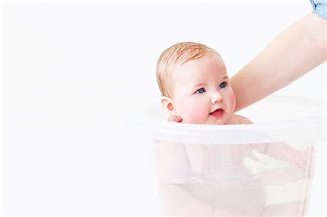 Basically a baby in a bucket. Tummy Tub The Original Bath Bucket Clear