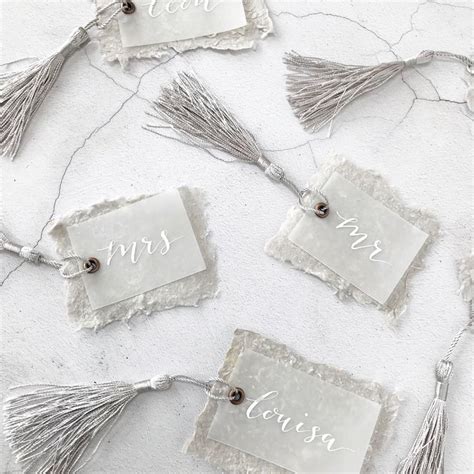 Even though you're just wishing the happy couple congratulations, it can be difficult to find the perfect words to give genuine meaning to your card. Luxury wedding place setting tags with hand written white ...