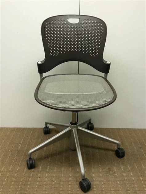 Eames aluminum group chairs, executive chair, soft pad chairs, table universal base, and table segmented base; Used Office Chairs : Herman Miller Caper Chair Armless at ...