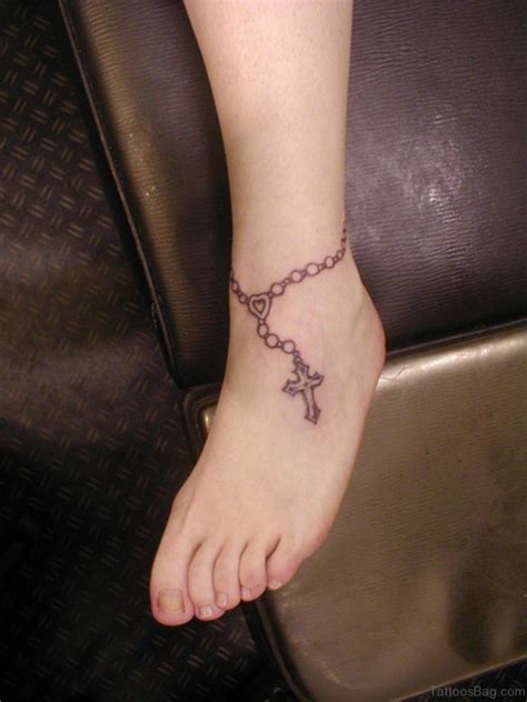 A rosary tattoo looks elegant on the girl's wrist. 63 Cool Rosary Tattoos On Ankle