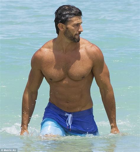 A king snake's strength is in its squeeze. Tim Robards shows off his six-pack and buff body at the ...