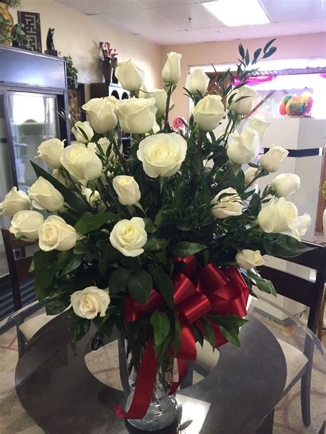 This wonderful straw basket as a woman's summer hat decorated with resh flowers, always bright and beautiful. All White Love in Las Vegas, NV | Sun City - Summerlin Florist