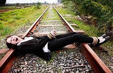 tied women railroad track distress bondage sacrifice damsels danger young moral terror woman men sacrificing man willing businesswoman screams stock