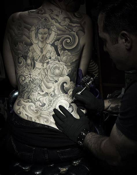 Operating cash registers, moving and lifting merchandise). Portrait of Corey Miller, tattoo artist and owner of Six Feet Under in Upland, CA for Tuaca ...