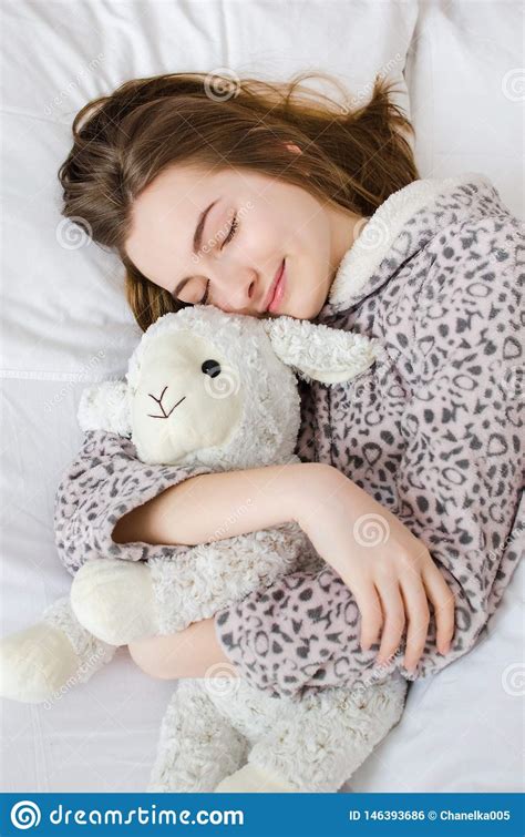 Teen Girl Sleeping With Toy Stock Photo - Image of hugging, blonde ...