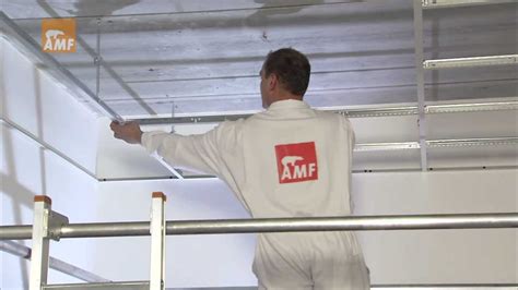 Therefore we offer a comprehensive product portfolio of modern acoustic solutions in the fields of room and building acoustics. Knauf AMF Deckensysteme - Montagefilm Sichtbares System ...