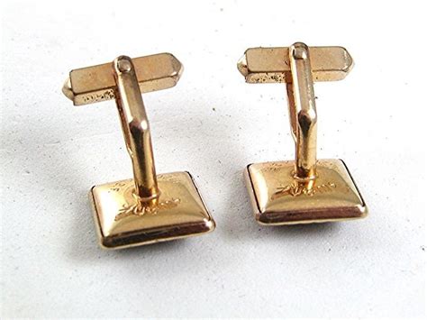 Gold, silver, and platinum are obvious favorites, especially for cufflinks that have no other decorative materials, and that rely on the quality of their metal alone for aesthetic value. Vintage 1/20 12Kt Gold Filled & Red Cufflinks By SWANK 81617